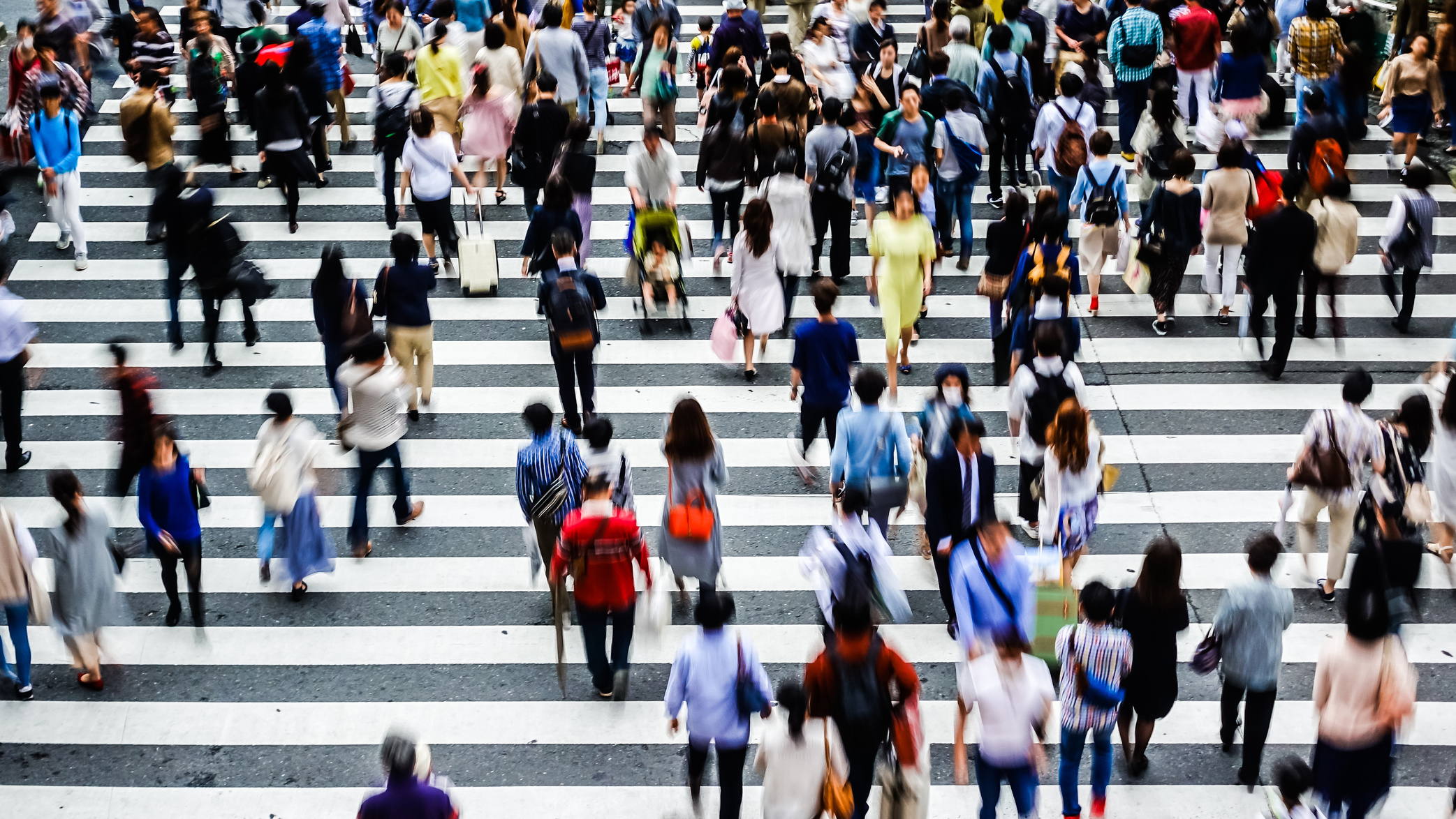 Asian People are across the crosswalk